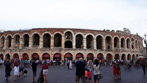 Group of people in front of historical building