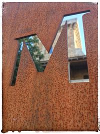 Low angle view of window on wall of building