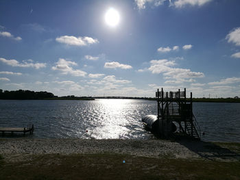 Pier over lake against sky