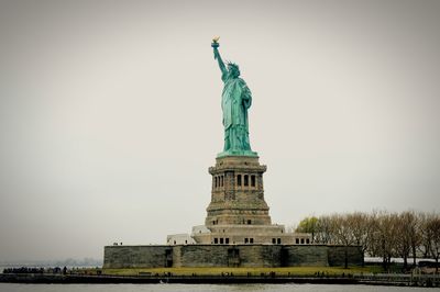 Low angle view of statue against sky