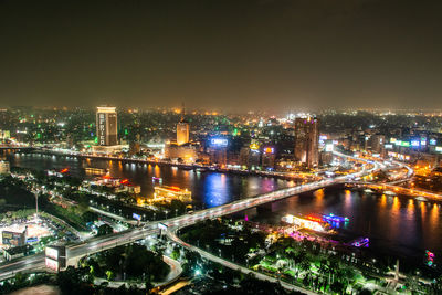 High angle view of illuminated city buildings at night