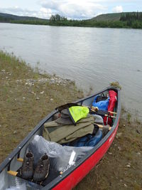 Reflection of man on boat in lake