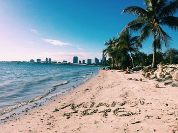 Scenic view of beach against blue sky