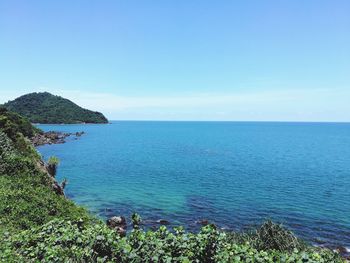 Scenic view of sea against clear blue sky