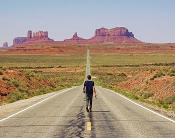 Woman walking on road