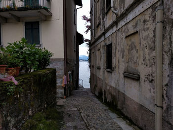 Narrow walkway leading towards building