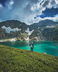 Rear view of woman walking on landscape