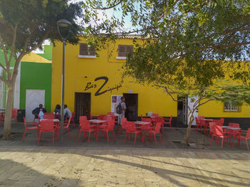 Chairs and tables in front of building