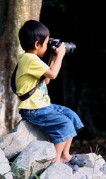 Portrait of boy photographing