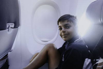 Portrait of young woman in car