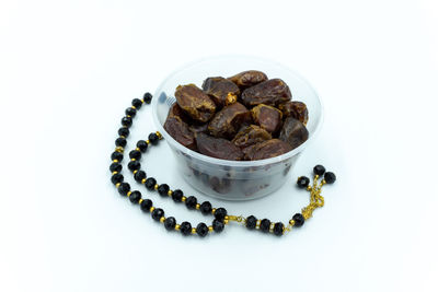 High angle view of chocolate cake on table against white background