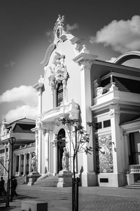 Low angle view of statue against sky in city