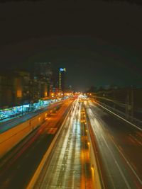 Light trails on city street at night