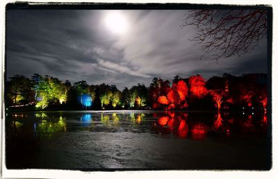 Scenic view of calm lake at dusk