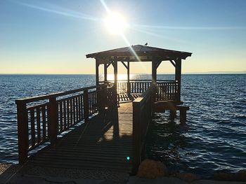 Pier over sea against sky