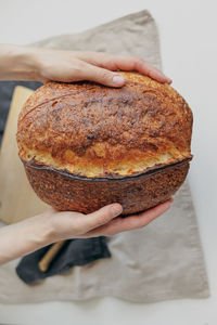Cropped hand of person holding bread