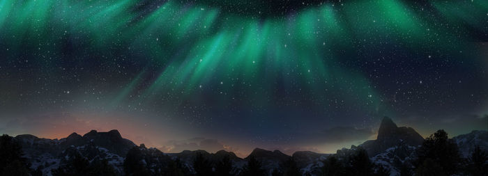 Low angle view of mountains against sky at night