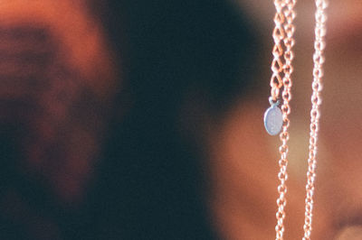 Close-up of chain against blurred background