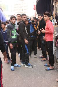 People standing on street in city