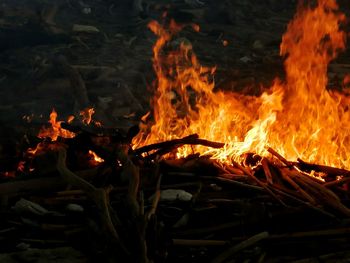 Close-up of bonfire on field at night