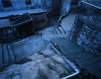 Low section of man on staircase during winter