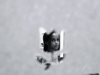 Portrait of girl seen through paper