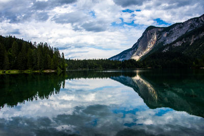 Scenic view of lake and mountains against sky