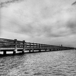 Bridge over river against sky
