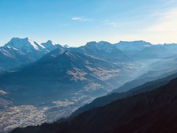 Scenic view of snowcapped mountains against sky