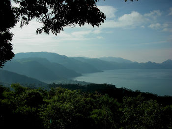 Scenic view of silhouette mountains against sky