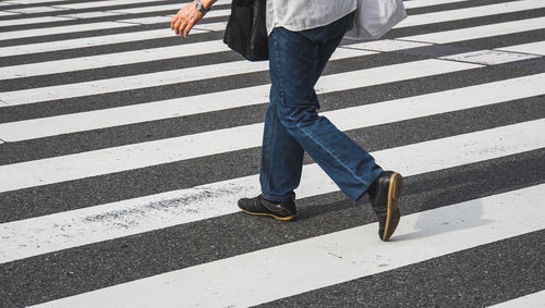 Low section of people crossing road