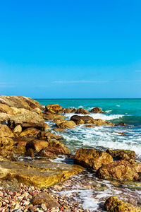 Stones of the sea breakwater. vertical image.