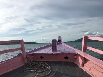Bicycles on beach against sky