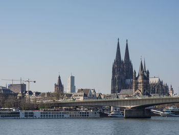 River in city against clear sky