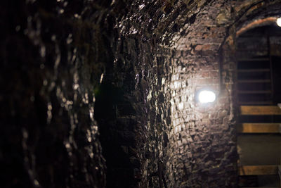 Low angle view of illuminated wall in building