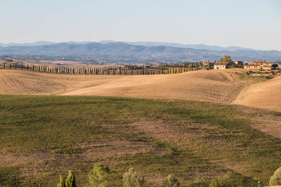 Scenic view of farm against sky