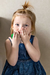 Little girl in the doctor's office.sitting waiting for a pediatrician examination. afraid.