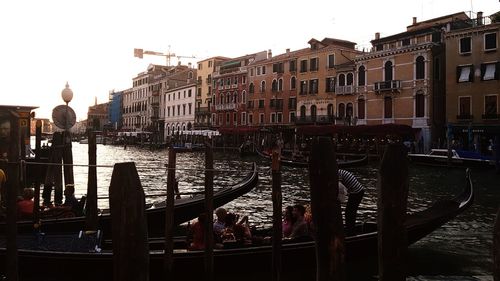 Canal passing through buildings in city