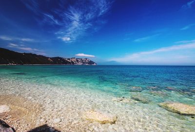 Scenic view of sea against blue sky