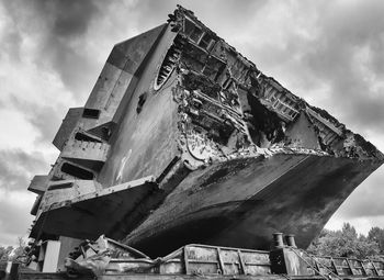 Low angle view of abandoned boat against sky