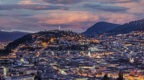 High angle shot of townscape against sky at sunset