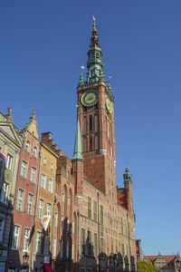 Low angle view of buildings against blue sky