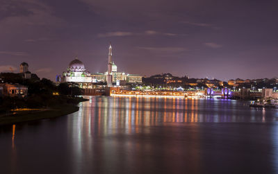 Illuminated city lit up at night