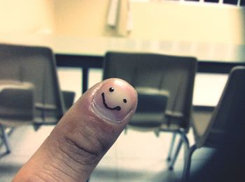 Close-up of hand holding cigarette