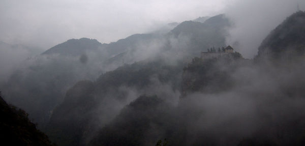 Scenic view of mountains in foggy weather