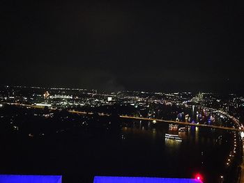 High angle view of illuminated buildings in city at night