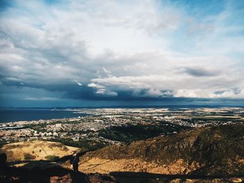 Aerial view of sea against cloudy sky