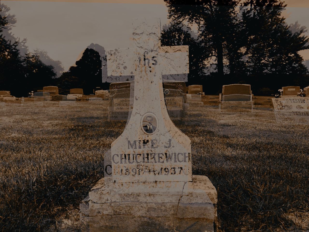 VIEW OF CEMETERY ON FIELD