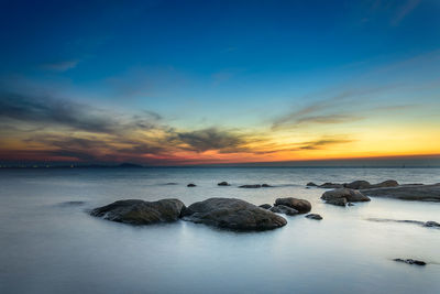 Scenic view of sea against sky during sunset