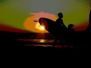 Silhouette of people at sunset